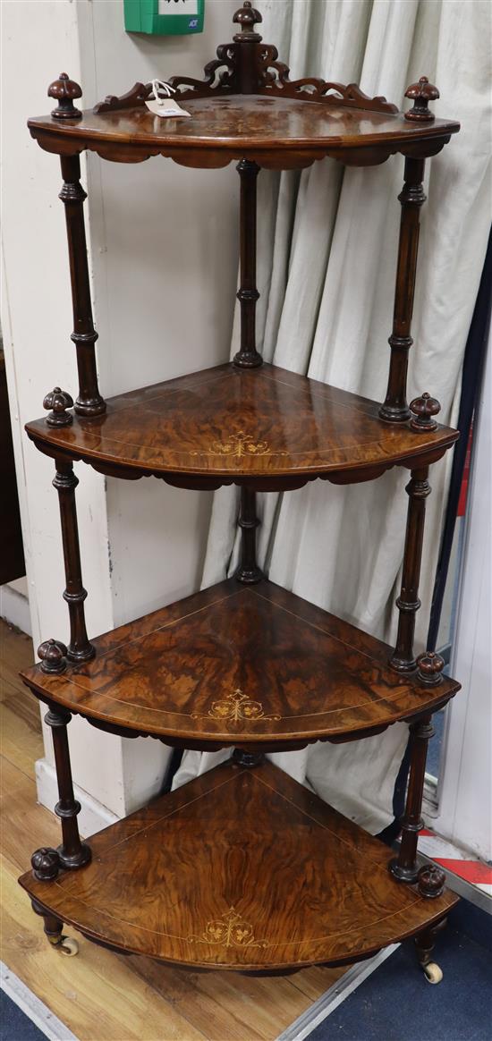 A Victorian marquetry inlaid walnut bow front whatnot, W.67cm., D.45cm., H.140cm.